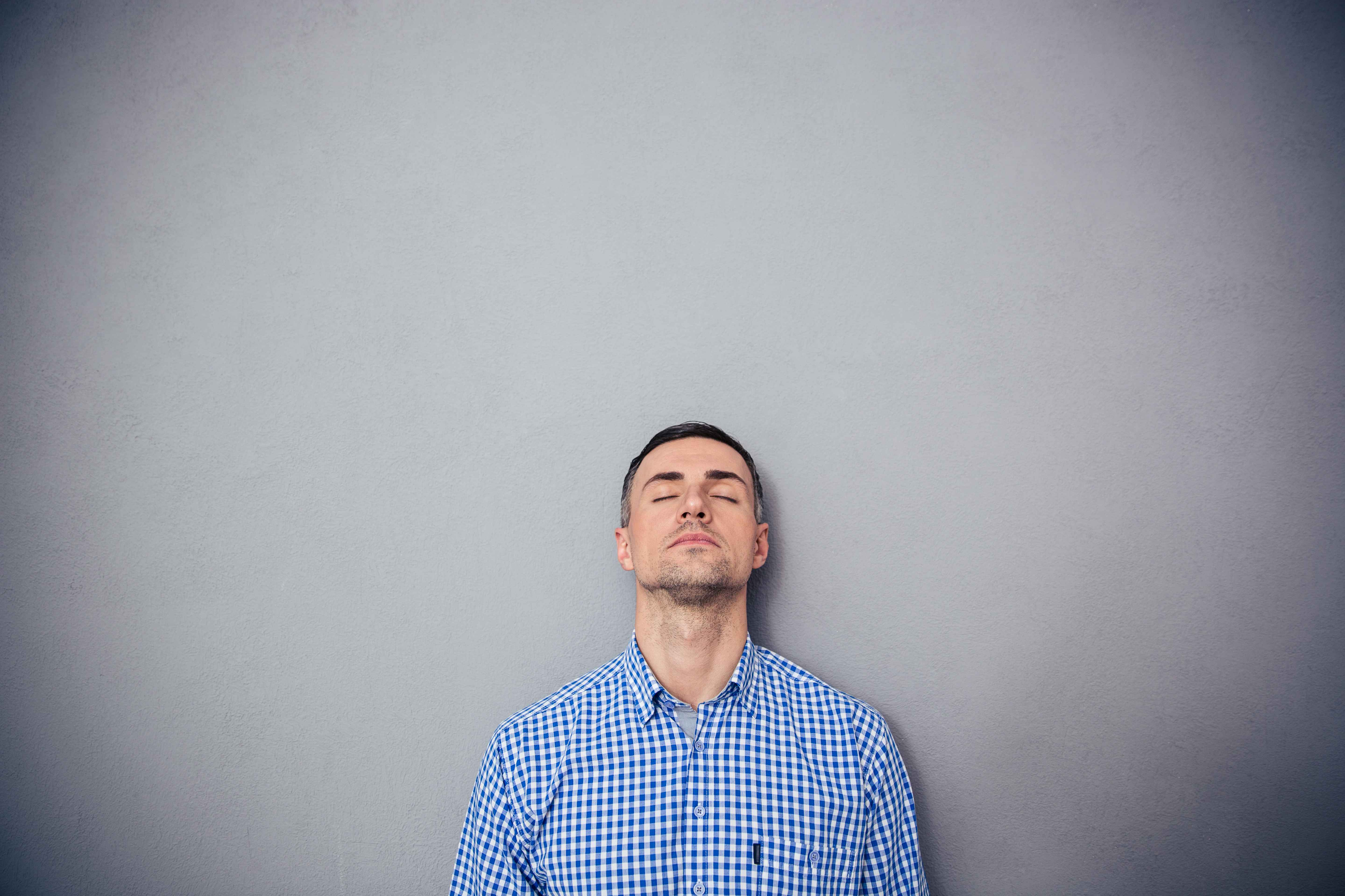 Portrait of a serious man with closed eyes